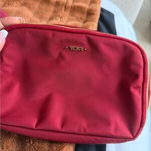 Tumi Burgundy Cosmetic Pouch with Gold Hardware